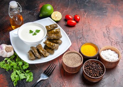 front view green leaf dolma with seasonings on dark desk dish meat food calorie dairy